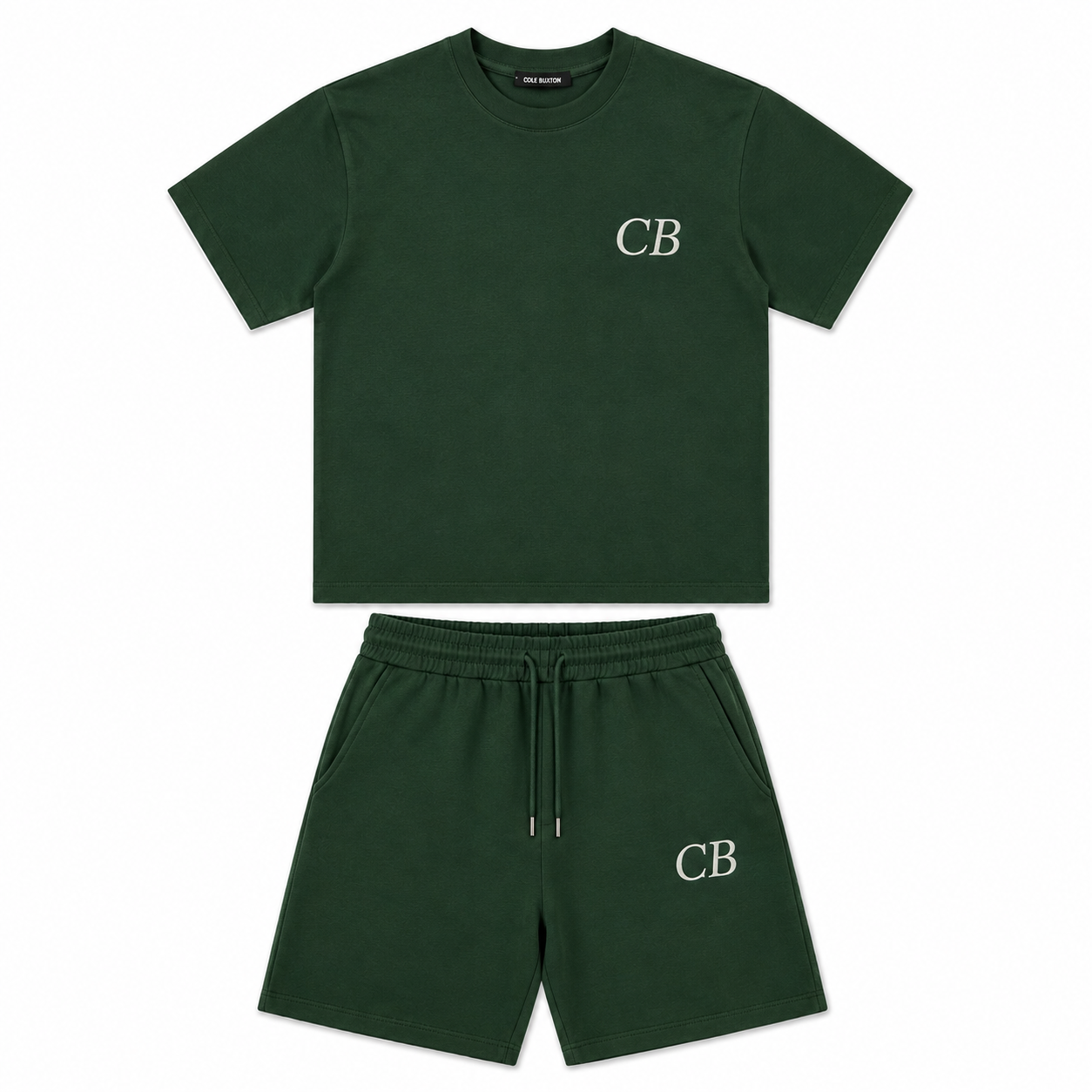 A dark green two-piece kids' outfit set consisting of a short-sleeve crewneck t-shirt and matching sweat shorts, both featuring a white embroidered 'CB' logo on the chest and left leg.