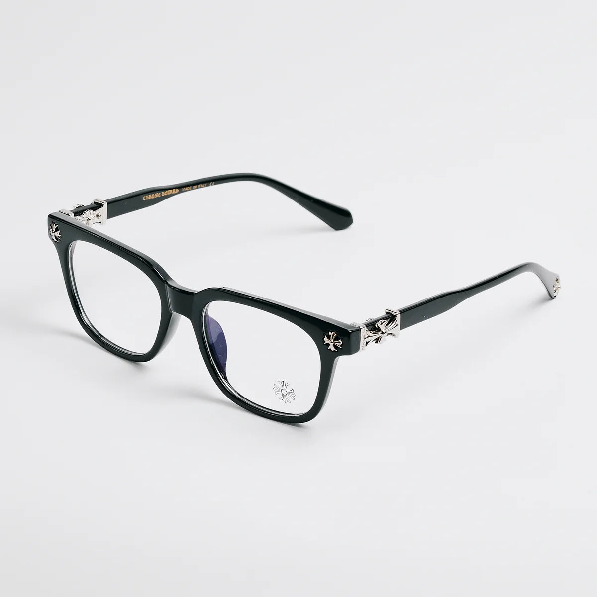 Black eyeglasses with decorative elements on a white background