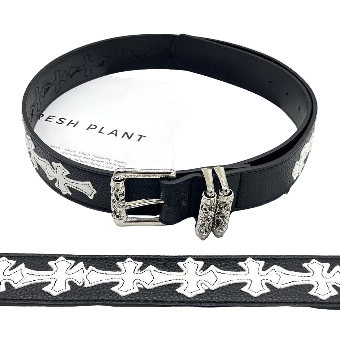 Black belt with decorative silver buckle on a magazine
