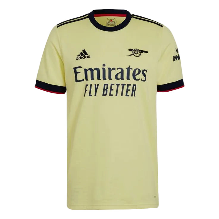A pale yellow Arsenal home soccer jersey by Adidas, featuring the club's cannon crest, the Emirates Fly Better sponsor logo, and navy blue trim on the collar and sleeve cuffs.