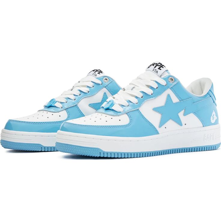 Pair of blue and white sneakers with star design on a white background