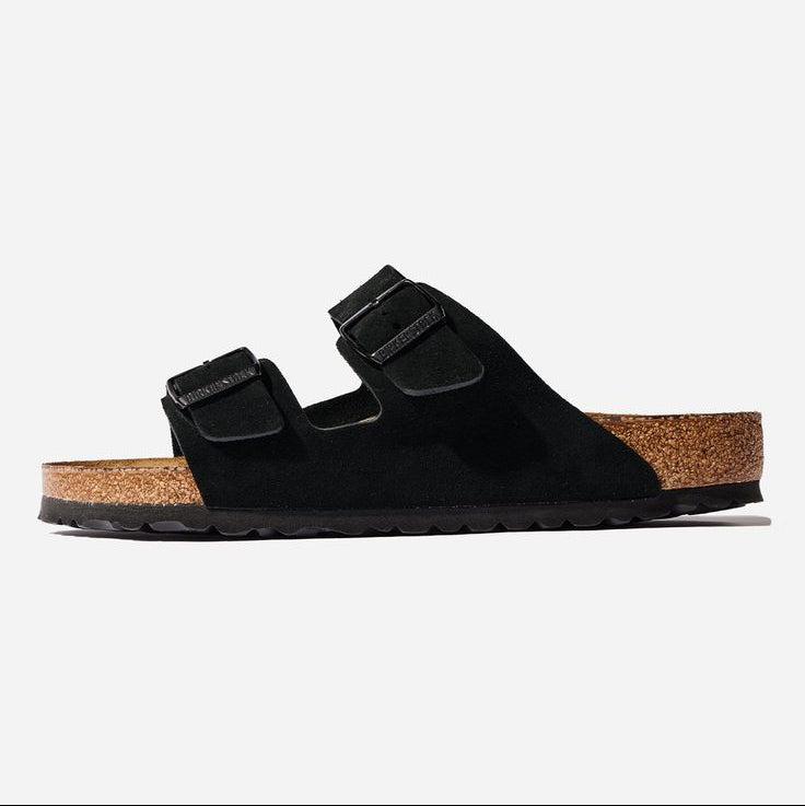 Black sandal with cork sole on a white background