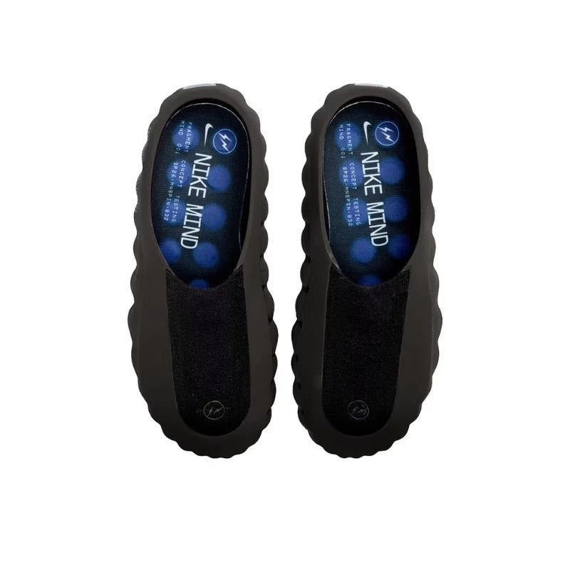 Black Nike shoes with blue digital display on a white background